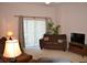 Living room with brown couches and sliding doors to a patio at 511 Rum Run # 33511, Davenport, FL 33897