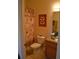 Bathroom with wooden vanity and butterfly artwork at 511 Rum Run # 33511, Davenport, FL 33897