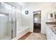 Main bathroom features a large tub, walk-in shower, and bedroom access at 163 Andalusia Loop, Davenport, FL 33837