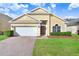 Charming one-story house with a two-car garage at 163 Andalusia Loop, Davenport, FL 33837