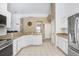 Modern kitchen featuring granite countertops and stainless steel appliances at 163 Andalusia Loop, Davenport, FL 33837