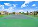 Well-maintained tennis court with basketball hoop at 163 Andalusia Loop, Davenport, FL 33837
