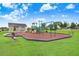 Community playground with playset and shaded area at 163 Andalusia Loop, Davenport, FL 33837