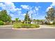 Gated community entrance with landscaping at 163 Andalusia Loop, Davenport, FL 33837