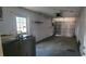 Attached garage with storage shelving and water heater at 2117 High Point Sw Ave, Winter Haven, FL 33880