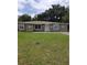 House exterior featuring a green door and landscaped yard at 1014 San Domingo Rd, Orlando, FL 32808