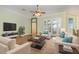 Comfortable living room with ample seating and hardwood floors at 24429 Madewood Ave, Leesburg, FL 34748