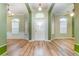 Bright and spacious entryway with light wood flooring at 24429 Madewood Ave, Leesburg, FL 34748