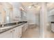Bathroom boasts double vanity, soaking tub, and walk-in shower at 24429 Madewood Ave, Leesburg, FL 34748