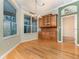 Bright dining area with hardwood floors and built-in hutch at 24429 Madewood Ave, Leesburg, FL 34748