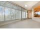 Bright sunroom with tile flooring, ceiling fan, and multiple windows at 24429 Madewood Ave, Leesburg, FL 34748