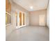 Sunroom featuring tile floors, French doors, and a ceiling fan at 24429 Madewood Ave, Leesburg, FL 34748
