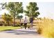 Gathering walking their dog along the community paved trails at 6075 Sacred Oak Ave, Mount Dora, FL 32757
