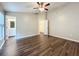 Bright bedroom with wood-look floors and ensuite access at 7713 Manor Dr, Lakeland, FL 33810