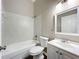 Clean bathroom with white vanity, tub and shower at 7713 Manor Dr, Lakeland, FL 33810