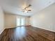 Spacious living room with dark hardwood floors and ceiling fan at 7713 Manor Dr, Lakeland, FL 33810