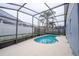 Kidney shaped pool with screened enclosure at 4636 Osceola Point Trl, Kissimmee, FL 34746