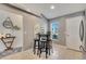 Bright kitchen nook with a table and four stools, perfect for casual dining at 254 Glasgow Ct, Davenport, FL 33897