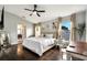 Spacious main bedroom with dark hardwood floors and a home office at 254 Glasgow Ct, Davenport, FL 33897