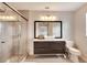Modern bathroom with a floating vanity, large mirror, and glass shower at 254 Glasgow Ct, Davenport, FL 33897