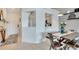 Bright dining area with a rustic table and modern chairs at 254 Glasgow Ct, Davenport, FL 33897