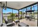 Relaxing screened patio with seating and outdoor dining at 254 Glasgow Ct, Davenport, FL 33897