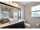 Updated bathroom with a floating vanity, white sink, and large mirror at 254 Glasgow Ct, Davenport, FL 33897