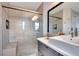 Clean bathroom with a glass-enclosed shower, built-in bench, and modern fixtures at 254 Glasgow Ct, Davenport, FL 33897