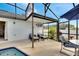 Covered patio with seating area and pool view at 254 Glasgow Ct, Davenport, FL 33897