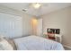Cozy bedroom with a double bed, built-in closet, and desk at 254 Glasgow Ct, Davenport, FL 33897