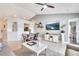 Spacious living room with vaulted ceilings and a large TV at 254 Glasgow Ct, Davenport, FL 33897