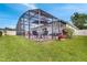 Inviting pool area with screened enclosure at 254 Glasgow Ct, Davenport, FL 33897