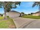 Home exterior showcasing a driveway and landscaping at 254 Glasgow Ct, Davenport, FL 33897