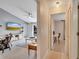 A light-filled hallway showcasing an office and living room at 254 Glasgow Ct, Davenport, FL 33897