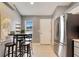 Bright kitchen nook with a table and four stools at 254 Glasgow Ct, Davenport, FL 33897