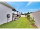 Landscaped backyard with lush lawn and fence at 254 Glasgow Ct, Davenport, FL 33897