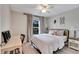 Spacious bedroom with a queen bed, desk, and large window at 254 Glasgow Ct, Davenport, FL 33897