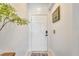 Bright and airy entryway with a white door and simple decor at 254 Glasgow Ct, Davenport, FL 33897