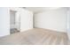 Spacious bedroom with neutral carpeting and en-suite bathroom at 3743 Bergamot St, Lake Alfred, FL 33850