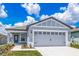 Two-car garage and light gray exterior at 3743 Bergamot St, Lake Alfred, FL 33850