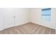 Spacious bedroom with neutral walls and carpeted floors at 3743 Bergamot St, Lake Alfred, FL 33850