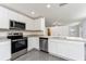 Modern kitchen with stainless steel appliances and granite countertops at 3743 Bergamot St, Lake Alfred, FL 33850