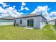 Newly constructed home with a grassy backyard at 3743 Bergamot St, Lake Alfred, FL 33850