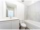 Clean bathroom with white vanity, toilet, and bathtub at 3743 Bergamot St, Lake Alfred, FL 33850