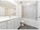 Clean bathroom with white vanity, bathtub, and modern tile at 3743 Bergamot St, Lake Alfred, FL 33850