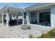 Relaxing backyard with covered patio, fire pit, and plenty of space for entertaining at 4552 Sequel Rd, Kissimmee, FL 34746
