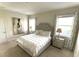 Main bedroom with a plush bed and stylish nightstands at 4552 Sequel Rd, Kissimmee, FL 34746