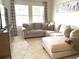 Bright Gathering room with large sectional sofa and TV at 4552 Sequel Rd, Kissimmee, FL 34746