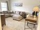 L-shaped sectional sofa and home office space in Gathering room at 4552 Sequel Rd, Kissimmee, FL 34746