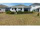 House exterior showcasing backyard, patio, and landscaping at 4552 Sequel Rd, Kissimmee, FL 34746